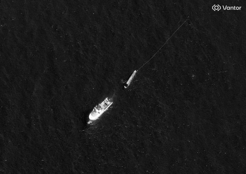 A satellite image taken on August 3 shows the Normand Ranger and SpaceX's Starship rocket. Attached to the nose of Starship is a long line.