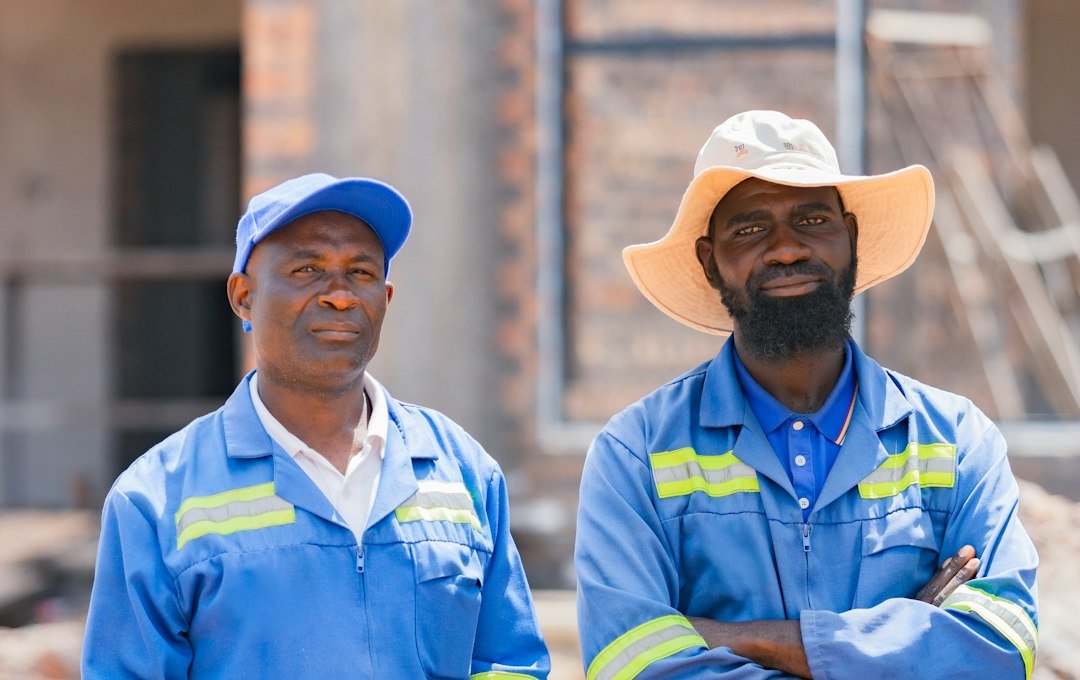 Workers at an African industrial site representing the mining sector