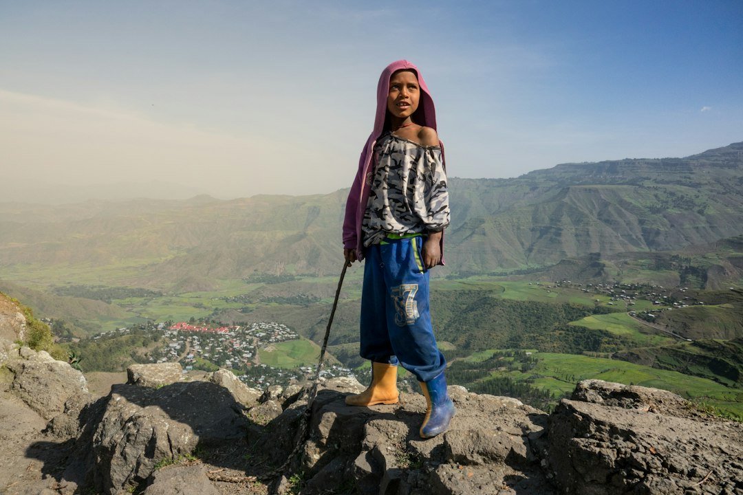 Young shepherd in the Ethiopian highlands; photo by Gerald Schömbs on Unsplash