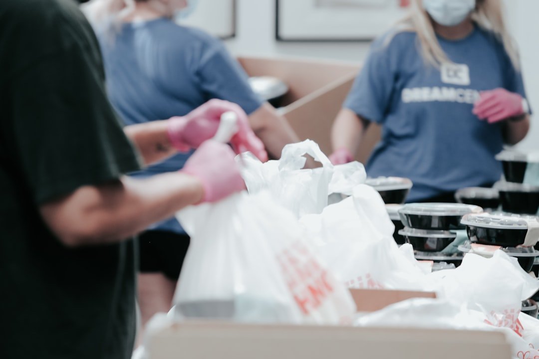 Volunteers packing food parcels for humanitarian distribution