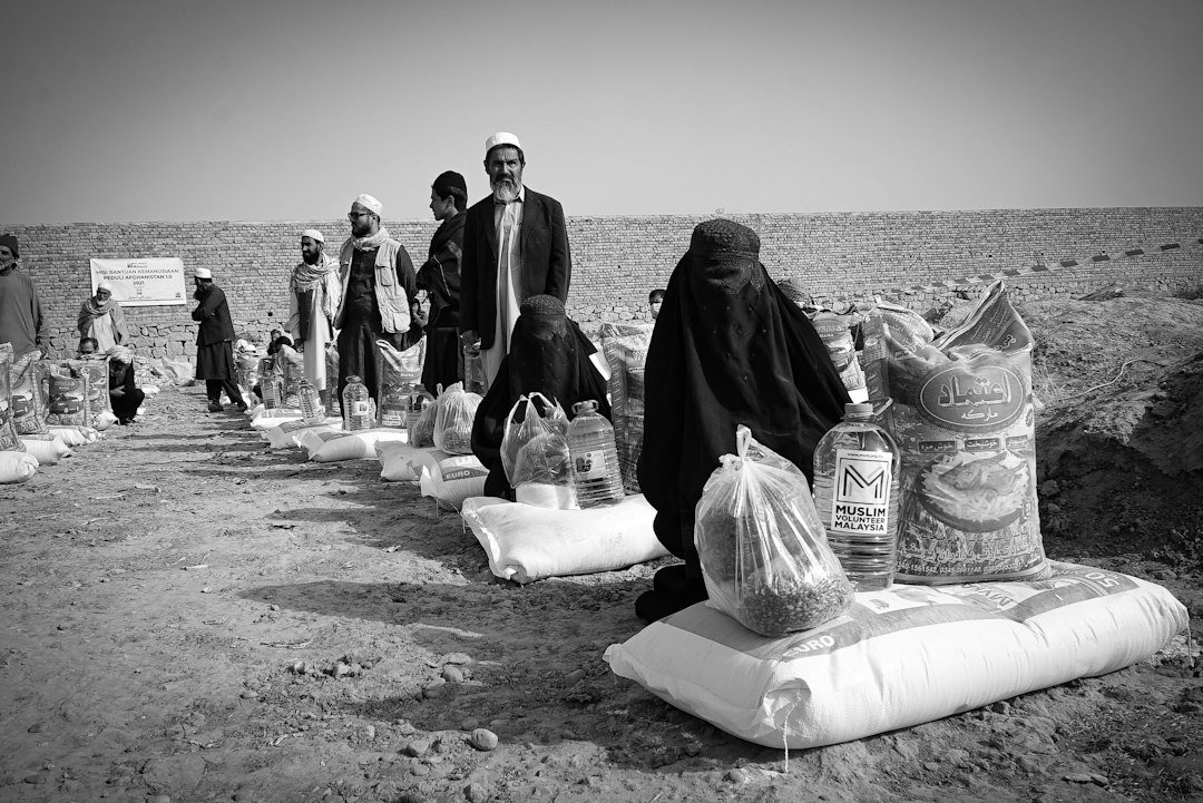 Women receiving humanitarian assistance in Afghanistan; photo by Wanman uthmaniyyah on Unsplash