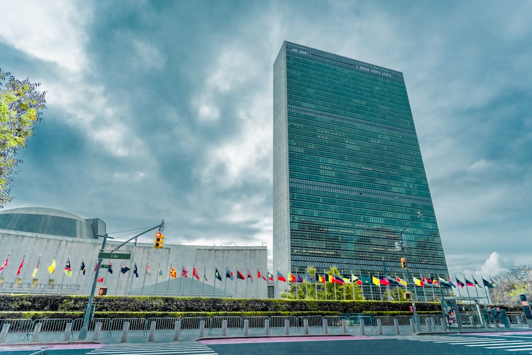 United Nations headquarters with member-state flags in New York