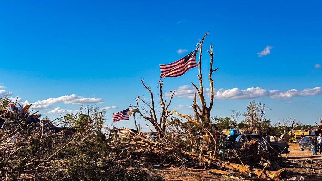 American flags above storm debris