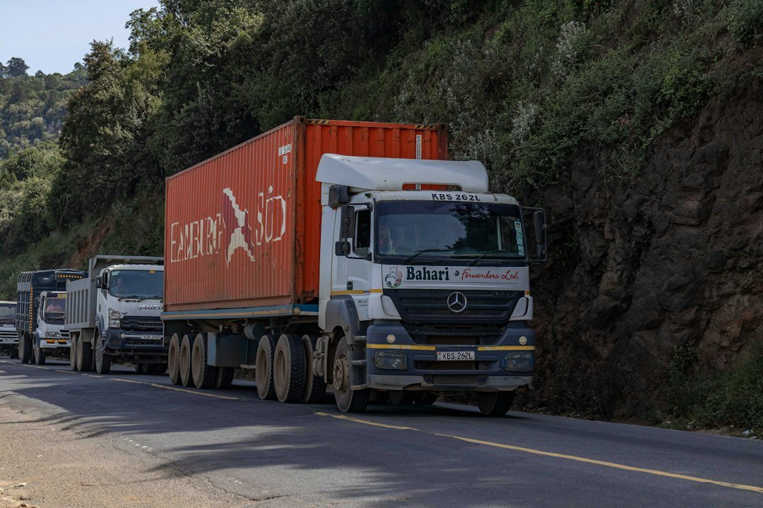 A supply truck travelling on a remote road, illustrating humanitarian delivery