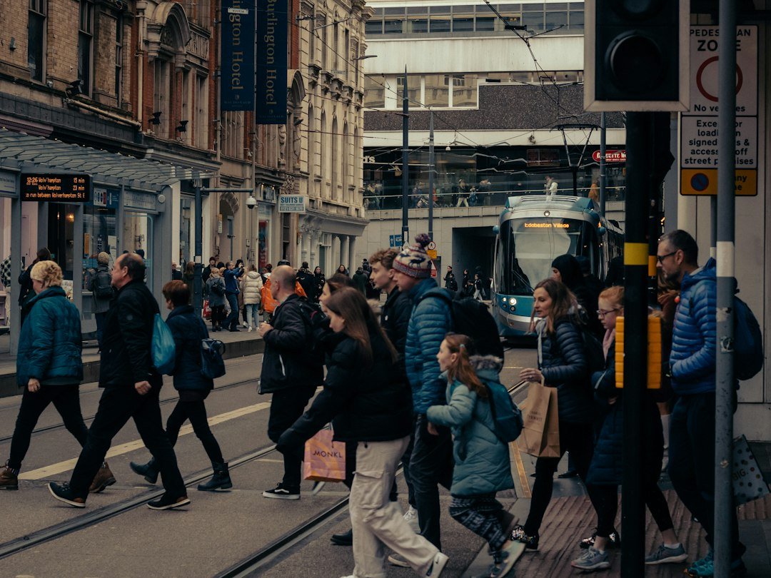People crossing a city street, illustrating social inclusion and access to services