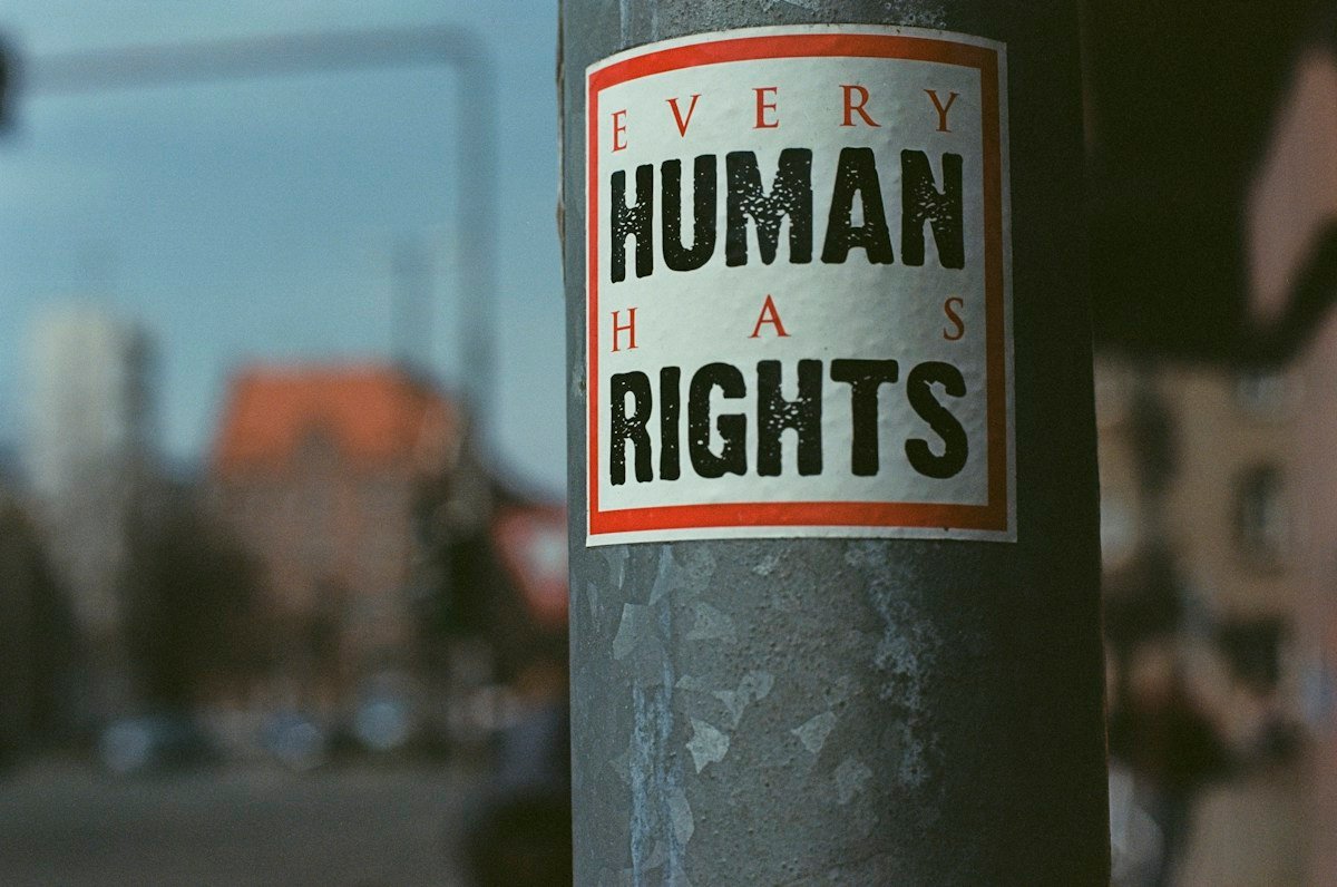 Illustrative street art stating Every Human Has Rights; not a photograph of the Geneva dialogue.